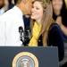 President Obama greets Michigan sophomore Christina Beckman with a kiss on the check after she introduced him to an audience of 3,000 at the Al Glick Fieldhouse on Friday morning.  Melanie Maxwell I AnnArbor.com